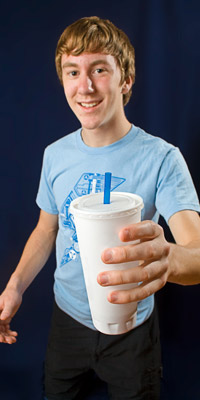 A boy holding a drink